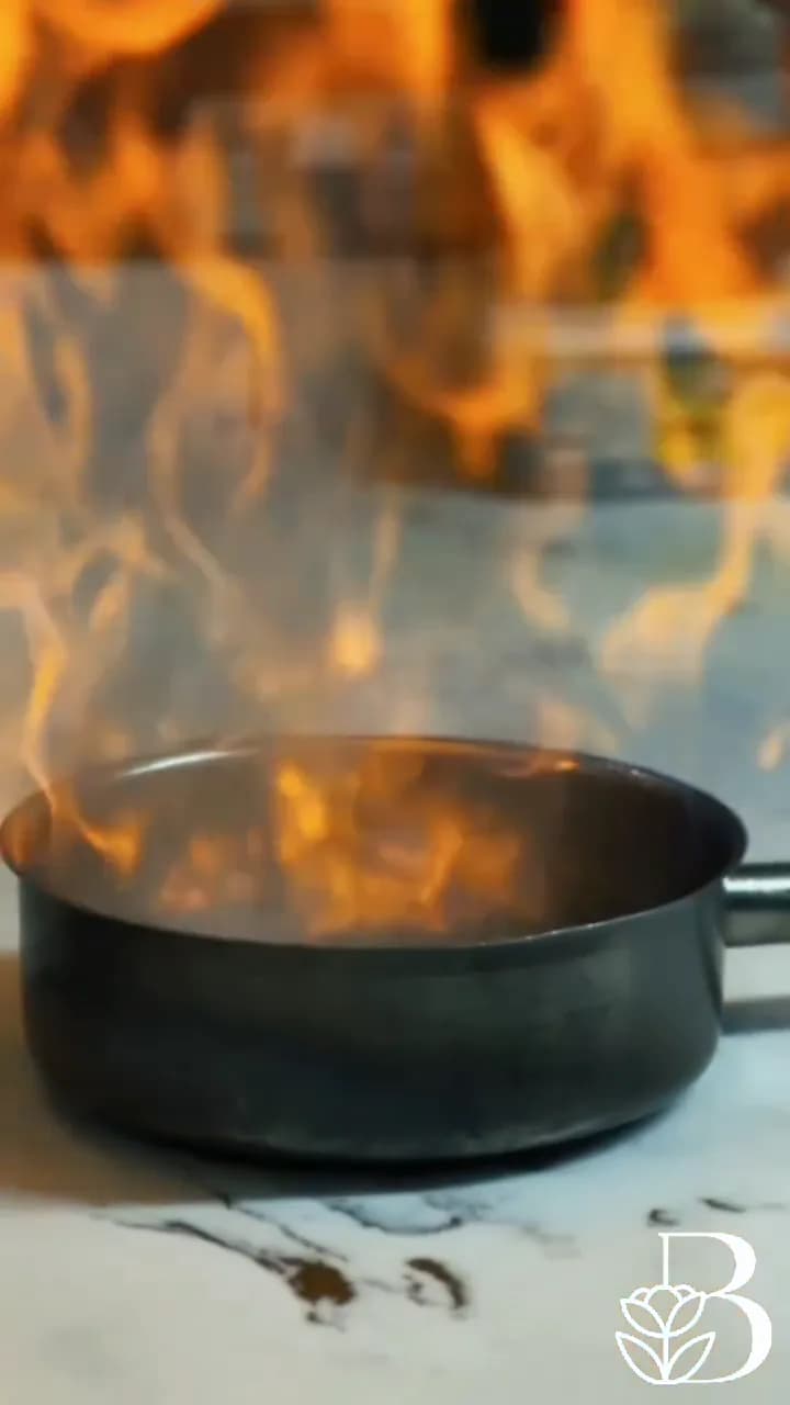 Flaming pan in the kitchen at The BlackHeath House