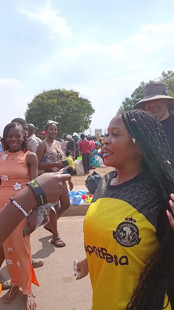 Fans in World Star Betting shirts dancing outside the stadium